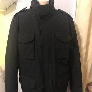 Men’s jacket Tumi. Black in excellent condition.